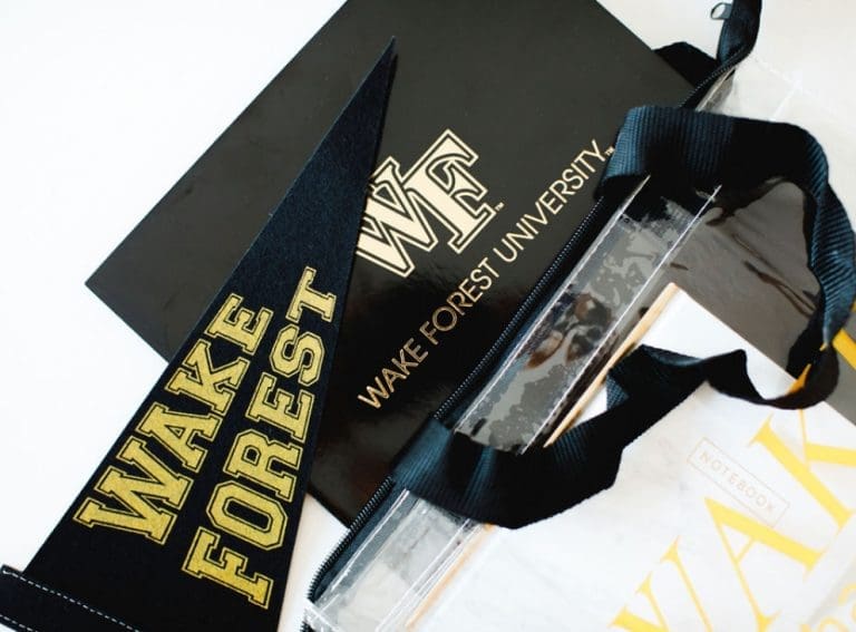 A variety of Wake Forest branded merch laid out on a table